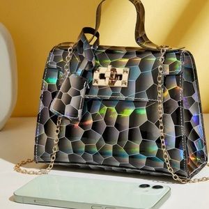 Holographic showstopping handbag.